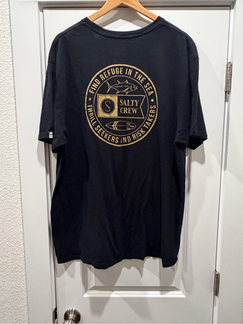 Salty Crew Black Short-Sleeve Tee with Gold Circular Logo